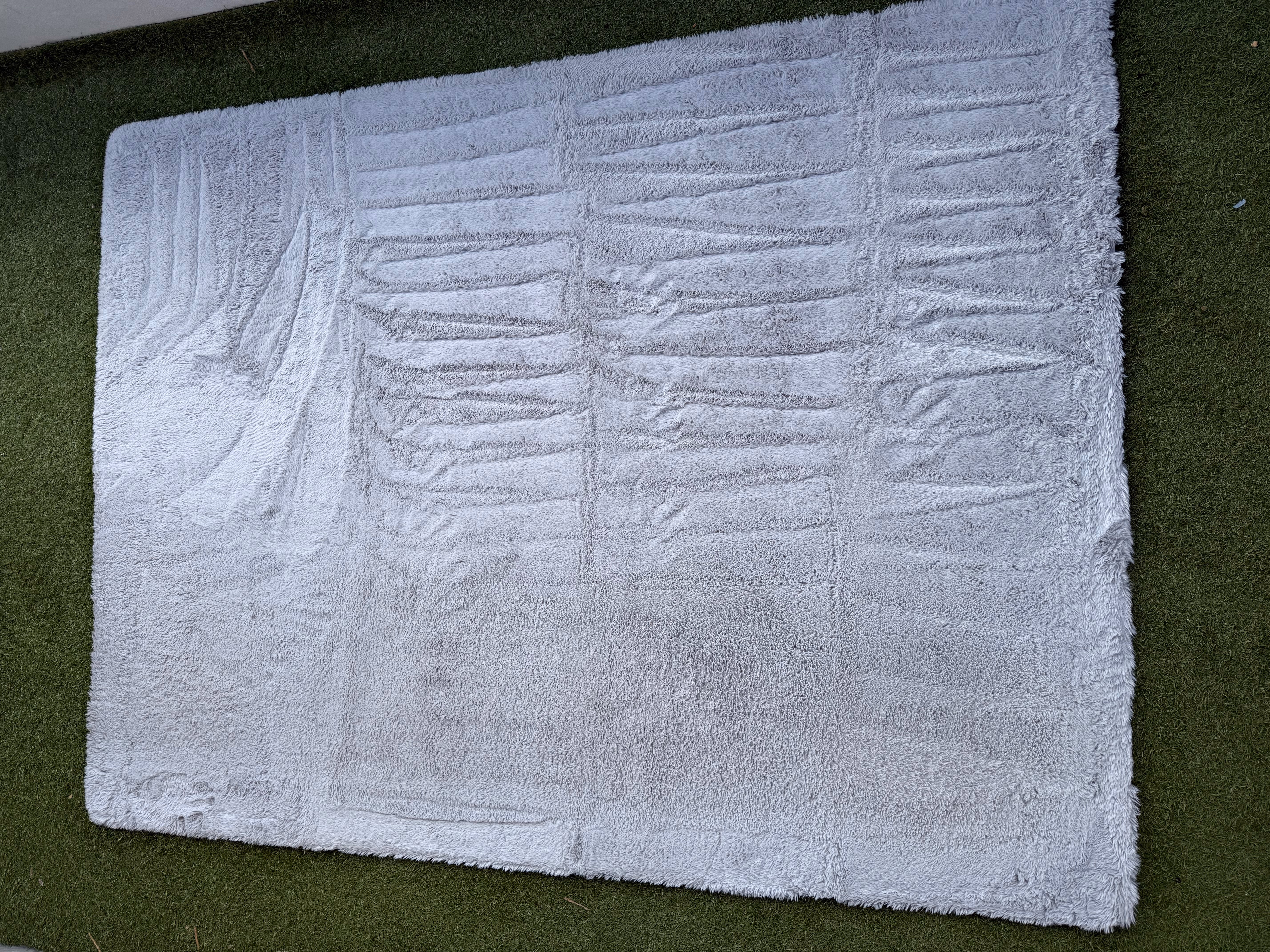 Tapis blanc après nettoyage